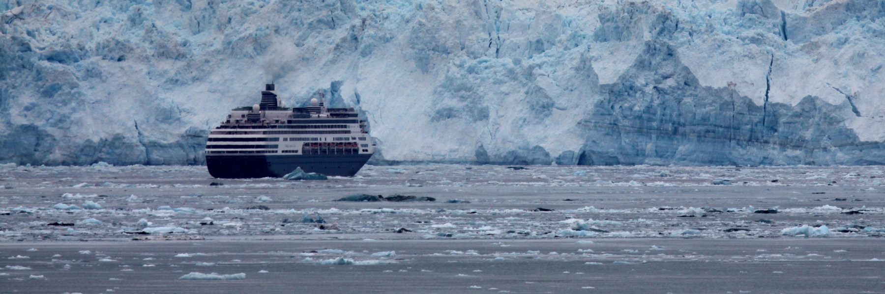 A cruise ship in front of a tidewater glacier in Alaska